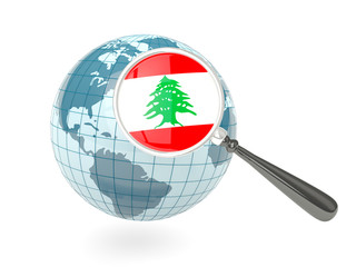 Magnified flag of lebanon with blue globe