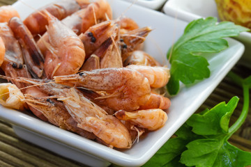 Sea shrimp with parsley on the plate