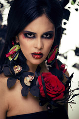 
 Save
Download Preview
pretty brunette woman with rose jewelry, black and red, bright make up like a vampire