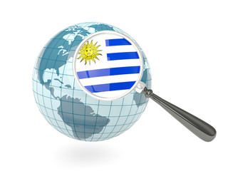 Magnified flag of uruguay with blue globe