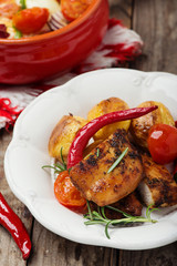 oven baked chicken fillet with potatoes © Kamila Cyganek