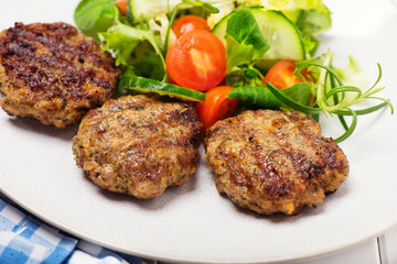 grilled minced meat steak with salad
