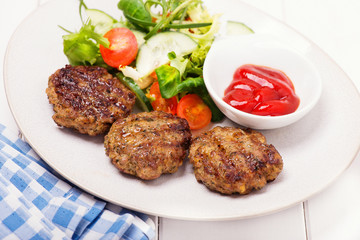grilled minced meat steak with salad