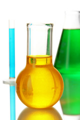 Test tubes with colorful liquids isolated on white