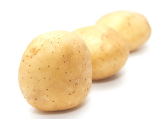 Fresh potatoes on a white background