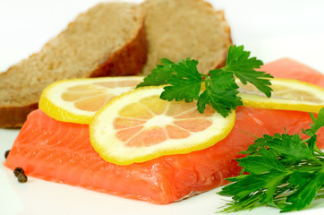 Salmon, lemon slices and parsley