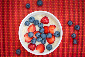 Hot oatmeal breakfast with fresh fruits