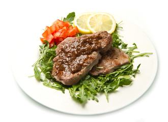 fresh grilled red meat with vegetables and sauce