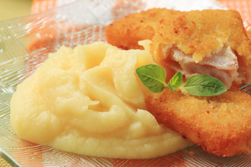 Fried breaded fish and mashed potato