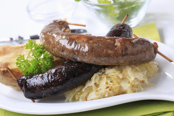 Sausages, sauerkraut and baked potato