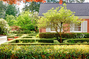 Brick red house with English garden.