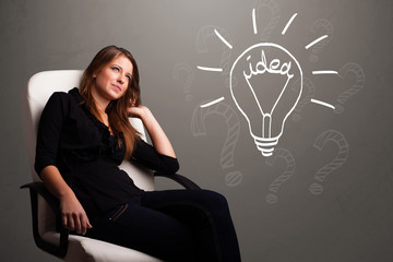 Young girl comming up with a light bubl idea sign