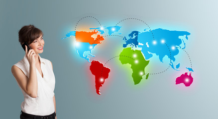 young woman making phone call with colorful world map