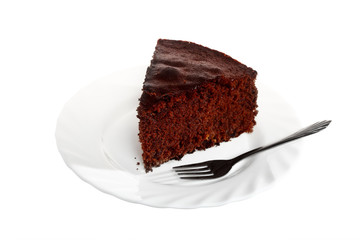 Piece of chocolate cake on white plate
