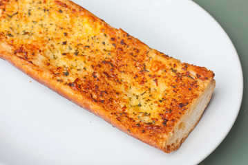 Closeup of crunchy garlic bread.
