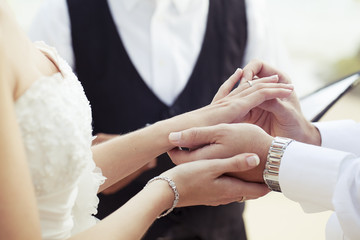 Hands newly married about wedding rings