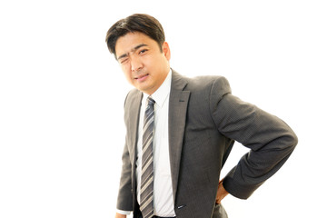 腰痛を訴えるビジネスマン