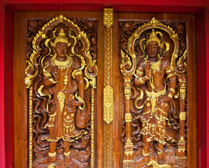 Carved wooden angel on the door
