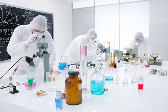 people analysing chemical reactions in a lab