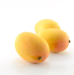 Ripe mangoes isolated on a white background.