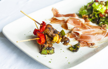 Gourmet grilled steak flavoured with vegetable salad .