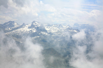 Fototapeta na wymiar Clouds and pinnacles of French Pyrenees mountains Pic du midi