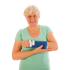 Old woman with broken wrist in gypsum
