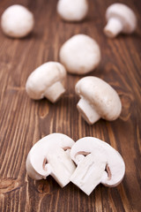 sliced champignons on a wooden background, selective focus