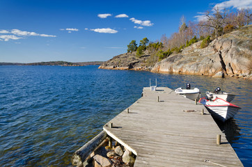 Wooden bridge on spring sea coast