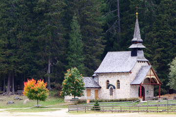 Fototapeta na wymiar Church on lake Lago di Braies in Dolomiti Mountains - Italy Euro