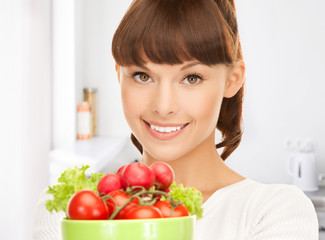 woman in the kitchen with tomatoes