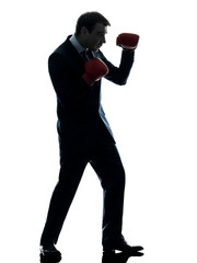 Fototapeta na wymiar business man boxer with boxing gloves silhouette