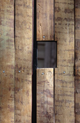 Picture of a wooden wall with a hole