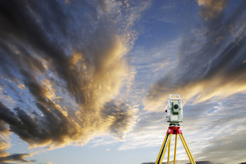 surveying measuring instrument, horizon and sunset - obrazy, fototapety, plakaty