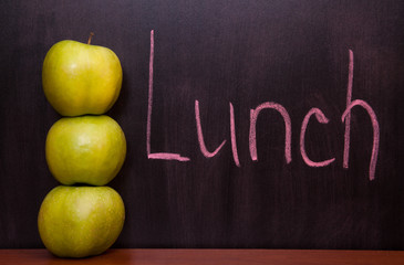 Apples on the chalkboard.