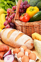 Assorted grocery products including vegetables fruits wine bread