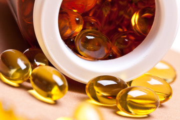 Cod liver oil omega 3 gel capsules isolated on pastel background