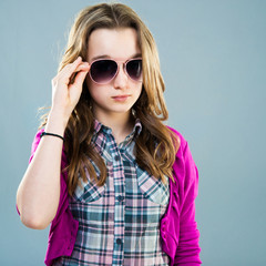 Fototapeta premium little fashion model in sunglasses