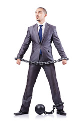 Businessman with shackles on white