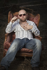 Obraz premium Sleazy Man in a Vintage Chair