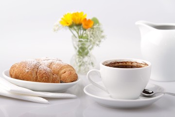 Breakfast with coffee and croissant