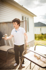 Obraz premium Boy playing cup and ball
