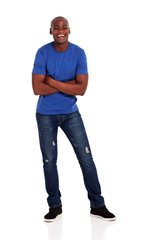 Naklejka premium cheerful young african american man with folded arms