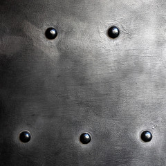 Black metal plate or armour texture with rivets