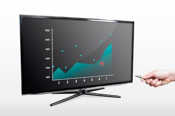 Man showing stock chart with laser pointer on tv screen