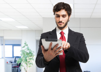 Business man holding his tablet