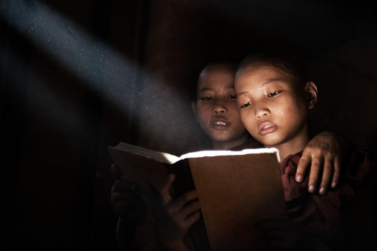 Little monks reading book