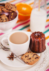 Chocolate cookies, cannele and cappucino