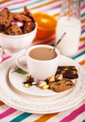 Coffee cup with cookie on the table
