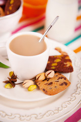 Coffee cup with cookie on the table